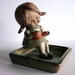 UC CTI Japan Clay Figurine - Vintage Little Girl Sitting with Watering Can In A Planter Box