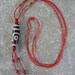 Two-eyed dzi bead pendant necklace