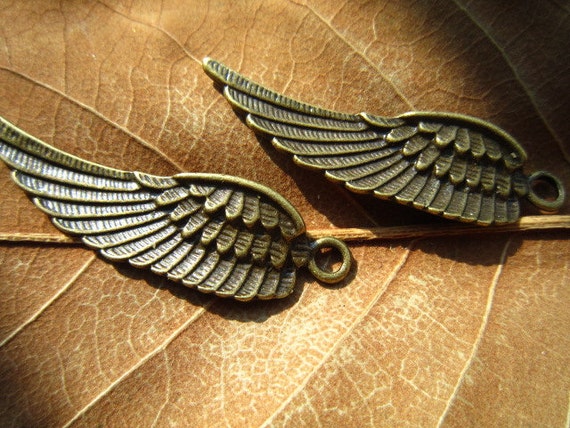 Items similar to 10pcs 45x14mm antique bronze angel wing charm pendant ...