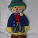 Hand Knitted Scarecrow doll./ with a tiny mouse poking out of his hat