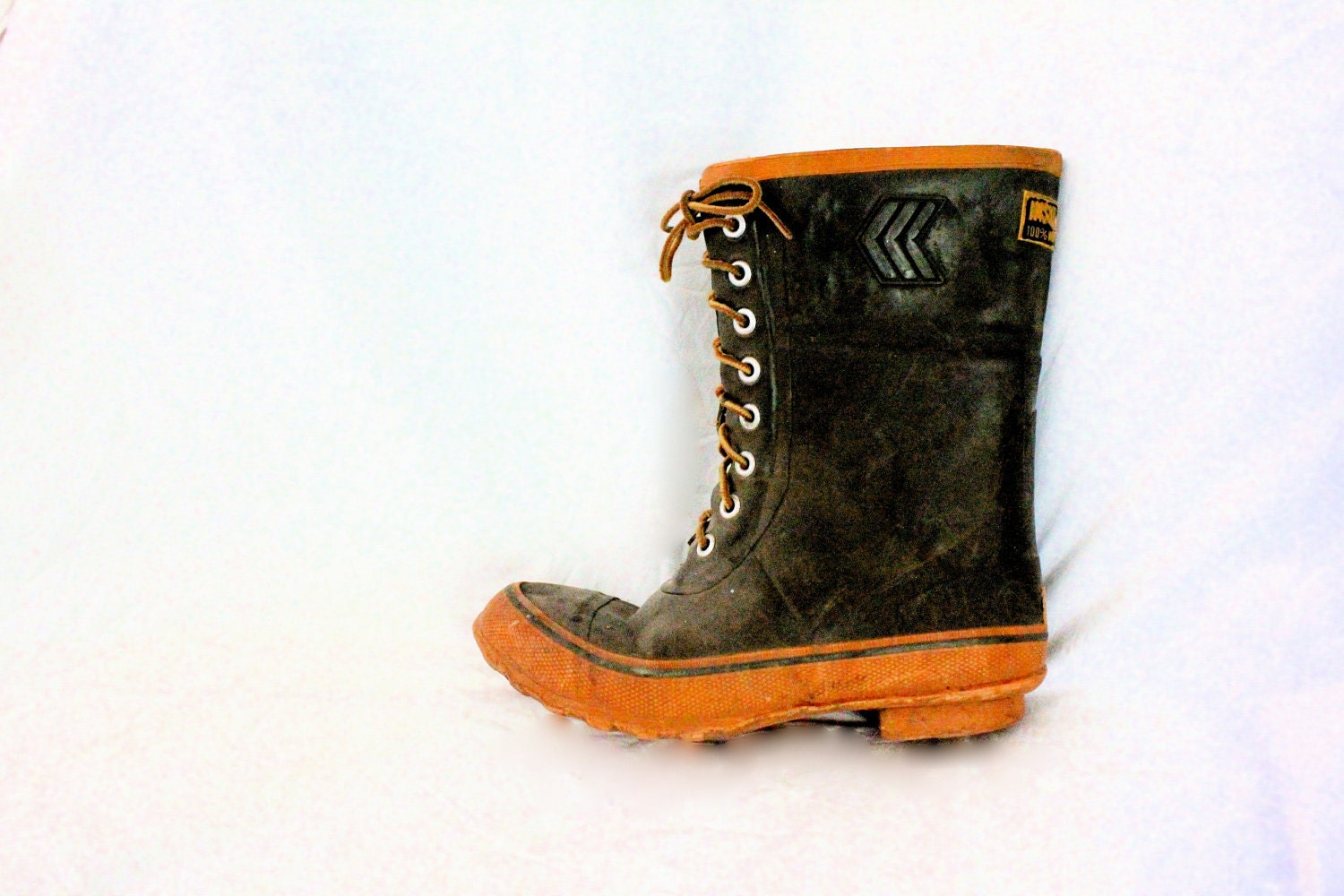 green rubber boots with yellow laces