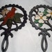 Pair of decorative cast iron trivets