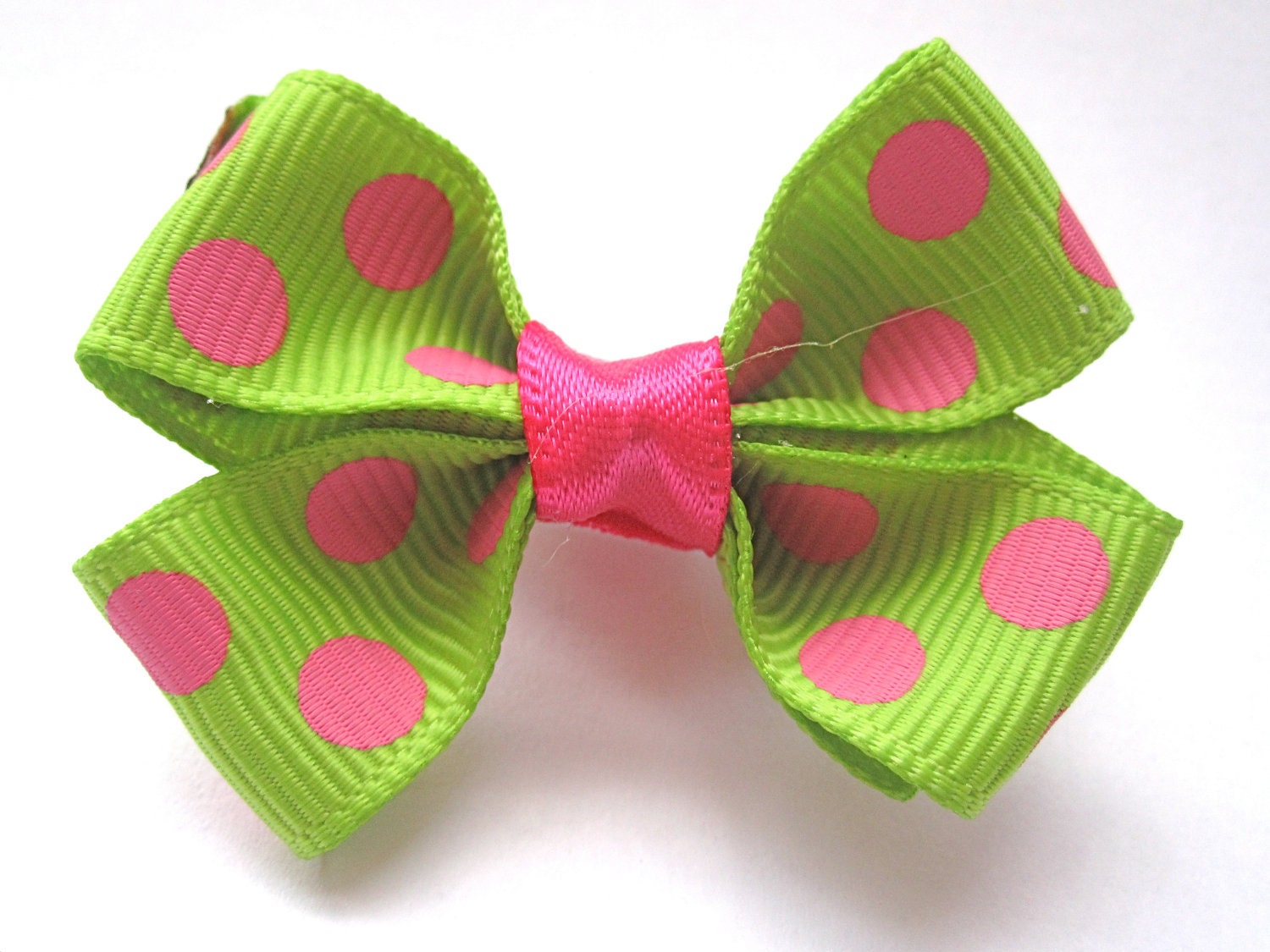 Green and pink polka dot bow