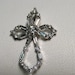18k White gold Diamond cross pendant with round and baguettes.
