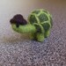 Needle felted miniature turtle with a dark brown hat