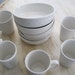 China set of 5 white bowls and six coffee mugs