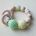 Teething toy with crochet green/ mint, light pale yellow wooden beads and 2 wooden rings. Wooden rattle. Teething ring