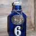 Cobalt blue medicine bottle with vintage items