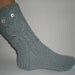 Hand-knitted light grey color women socks with owl pattern