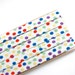 LAST ONE: white w/ multicoloured dots - double fold, bias tape - 2.5 yards, 3/8" wide