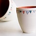 Ceramic Bowls in Coral- Flag Decoration in Teal, Coral, and Blue