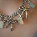 Bows and Cleavers. Cute bows with big cleavers. 16.5" long, antique silver colour.