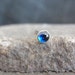 14k solid gold with CZ Blue sapphire bezel set nose screw