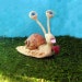 Lovestruck snail sculpture figurine