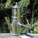 Shiny vintage French metal coffee pot with black wooden handles