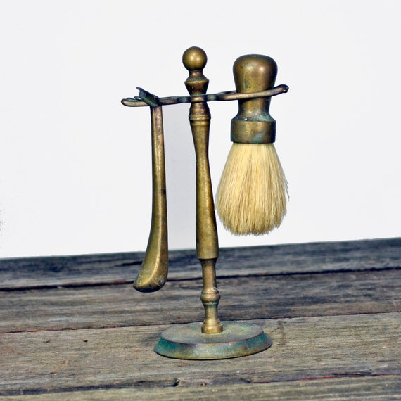 Antique brass shaving stand with razor and brush