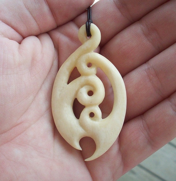 Items similar to Maori koru hand carved bone pendant on Etsy