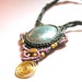 Turquoise and macrame necklace,Purple and green strings with bronze spiral,Organic materials,Bohemian chic jewelry