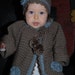 Hand crocheted baby sweater with matching hat