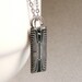 Upcycled geekery necklace Silver chip with bell