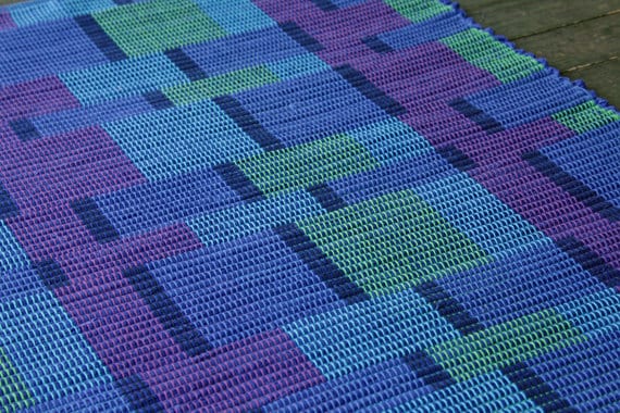 Handwoven blue purple and green cotton rug