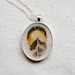 real feather resin necklace Natural Golden Pheasant pendant polka dot nature black and white cream set in silver bird woodlands prairie