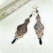 Copper earrings with oriental pattern.
