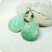 Brass earrings paisley with green blue patina.