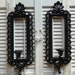 Hollywood Regency Set Grouping of 2 Black Candle Holders Sconces Ornate Wall Hanging High Regency Decor