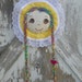 Barrette Holder with Brown Eyes long multi colored braids and cupcake accent Yellow Bonnet trimmed with lace