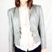 1980's Grey Wilsons Leather Jacket. razor sharp shoulders.