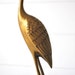 Tall brass crane