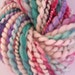 Renoir Bubbles - Maroon, turquoise, blue, mauve and cream. Hand painted and spun art yarn.