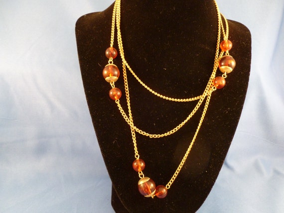 Items similar to Reddish Amber beaded gold necklace. (N72) on Etsy