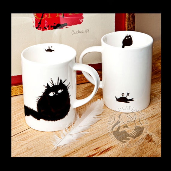  If your feline fur-baby has ever given you a gift, you'll appreciate these mugs!