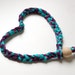 HEADBAND of braided elastan yarn and wood bead as lock, color mix violet, light blue pink, fuchsia