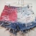 Awsome upcycled Old Navy denim cut off shorts size 4 waist 28 1/2 inches frayed ripped fabric painted with star shaped studs Fourth of July
