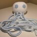 White Octopus with Blue Green Arms