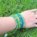 Set of six crochet bead bracelets - green,golden,peach,brown and silver