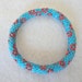 Matte turquoise crocheted beaded bracelet - turquoise bead bracelet with maroon red flower