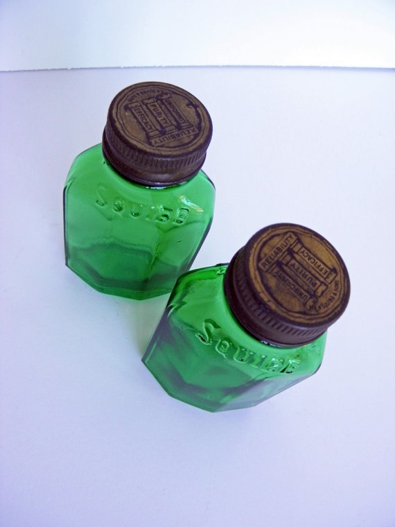 vintage green glass medicine bottles by squibb