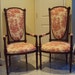 A Pair of Vintage Carved Wood Arm Chairs Upholstered in Red and White Toile Fabric