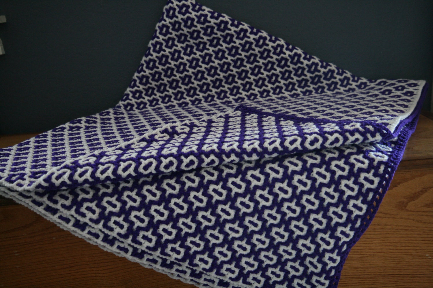 Purple and white reversible crochet afghan