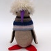 Woollen Penguin - Handmade plush sculpture with oatmeal wool body and furry cream hair - with purple felt beak and red felt feet.