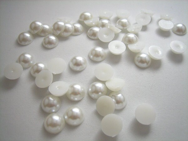 white flats with pearls