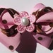 pink and brown polka dot flower hair bow