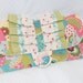 clutch - mutli colored patterned fabric with green, blue, cream and pink ruffles