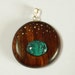 Ironwood and turquoise and silver round pendant