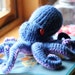 Knitted Octopus Toy Red Blue Purple, Medium sized with adjustable tentacles.