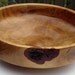 Hand turned wooden bowl made from a bradford pear .